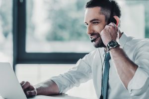 Man using Microsoft Teams as a business communication and collaboration tool.