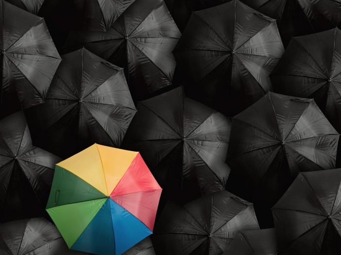 Leader concept using umbrellas demonstrates Microsoft Defender ATP as network security leader